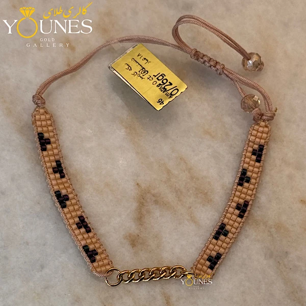 دستبند میوکی  کارتیر طلا کرم مشکی